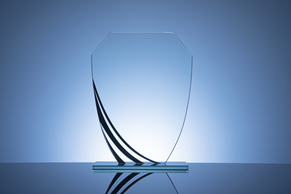 Elegant Blank Glass Shield Trophy On Dark Blue 2021 08 28 09 01 01 Utc