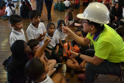 Engineer presenting to primary school aged children