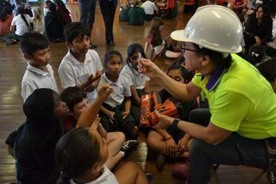 Engineer presenting to primary school aged children